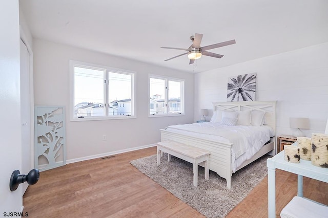 bedroom with hardwood / wood-style floors and ceiling fan