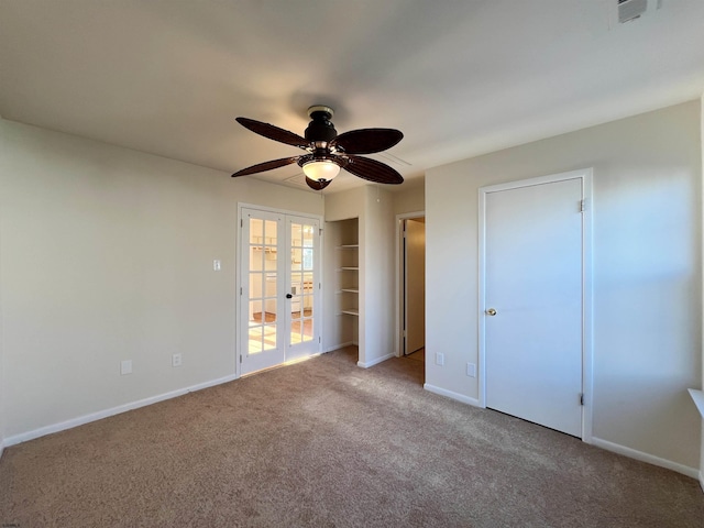 unfurnished bedroom featuring ceiling fan, light carpet, and french doors