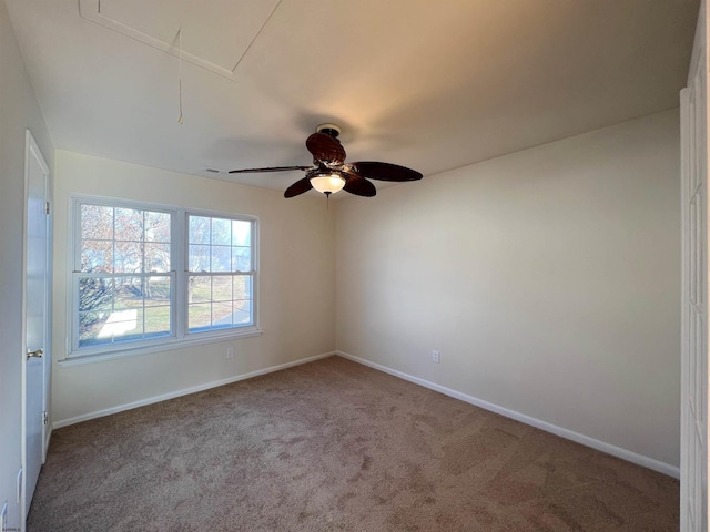 carpeted empty room with ceiling fan