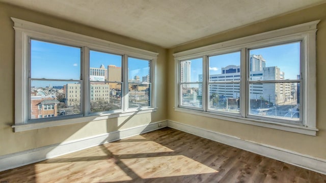 unfurnished sunroom with a wealth of natural light