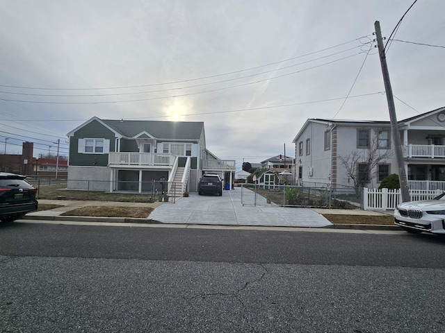 view of front of property featuring stairs and a residential view
