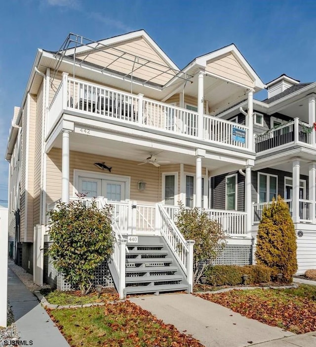 view of front of property with a porch and a balcony