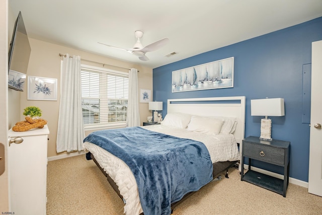 bedroom with ceiling fan and light colored carpet