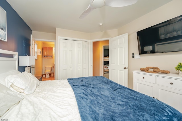 bedroom with ensuite bath, ceiling fan, and a closet