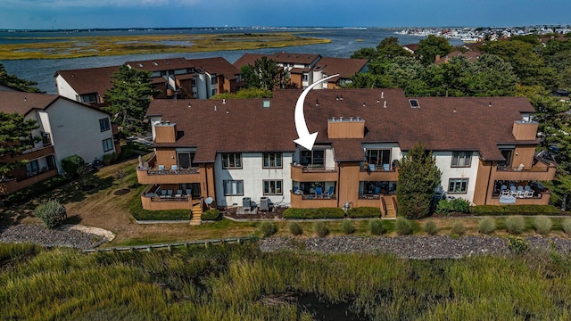 drone / aerial view featuring a water view