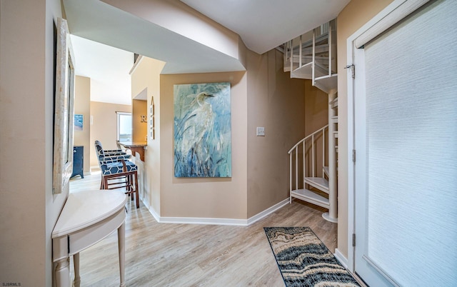 foyer entrance with light hardwood / wood-style flooring