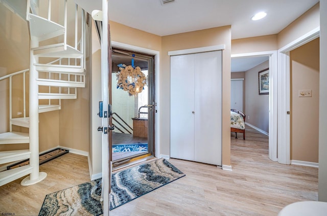 entrance foyer with light hardwood / wood-style flooring