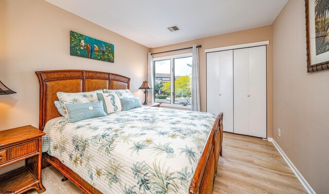 bedroom featuring a closet and light hardwood / wood-style flooring