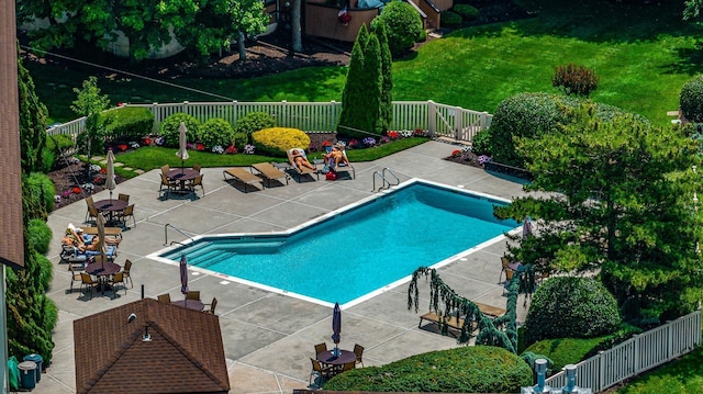 view of swimming pool featuring a patio and cooling unit