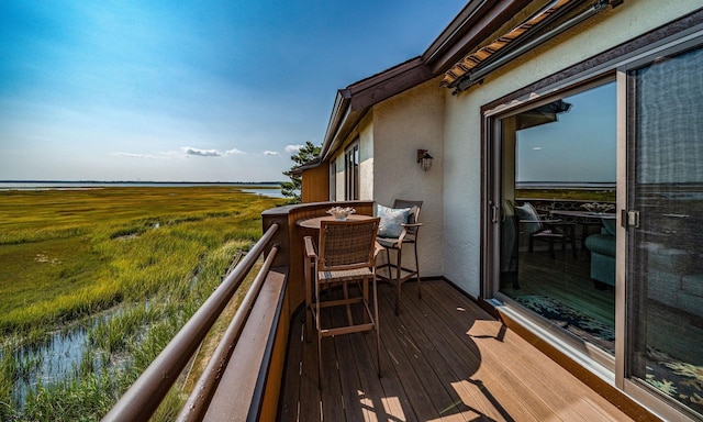 balcony featuring a water view