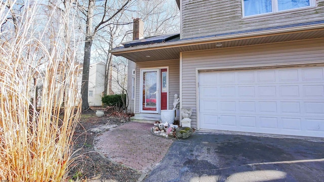 property entrance with a garage