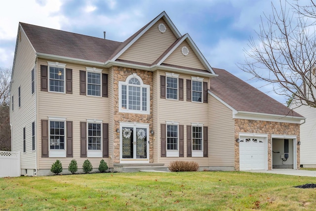 colonial inspired home with a front lawn