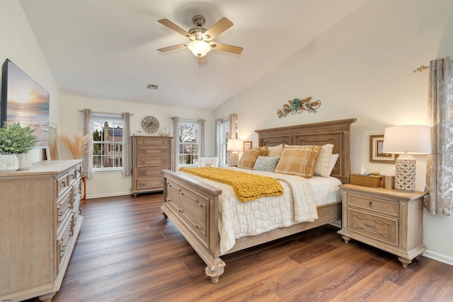 bedroom with ceiling fan, dark hardwood / wood-style floors, and vaulted ceiling