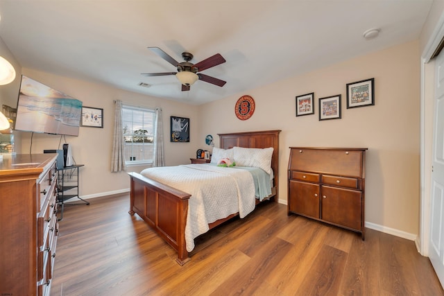 bedroom featuring ceiling fan and wood-type flooring