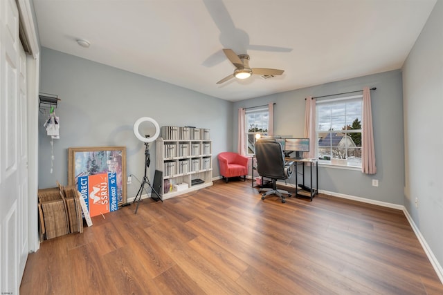 office with ceiling fan and wood-type flooring