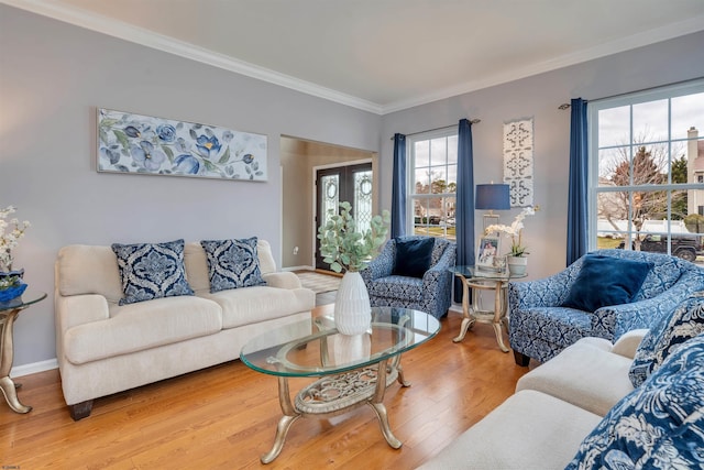 living room with hardwood / wood-style flooring and crown molding