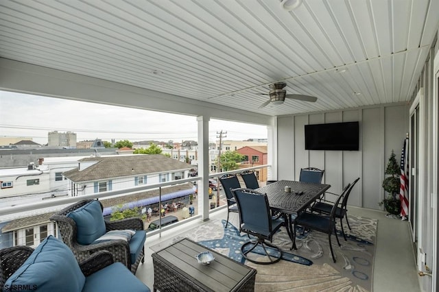 wooden terrace featuring ceiling fan