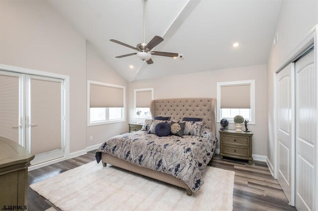 bedroom featuring dark hardwood / wood-style flooring, high vaulted ceiling, and ceiling fan