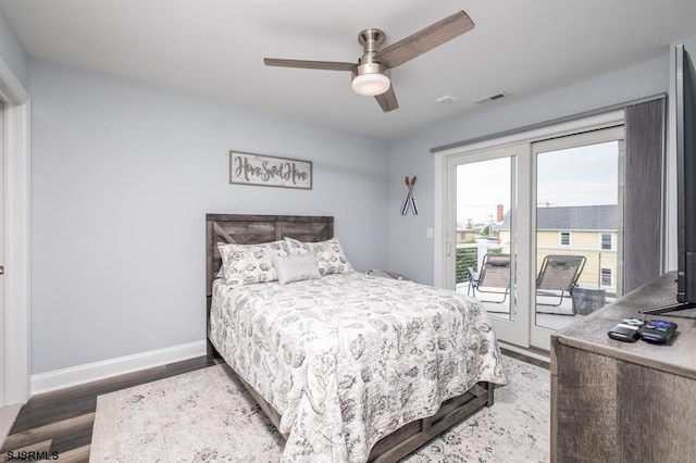 bedroom featuring ceiling fan, wood-type flooring, and access to exterior