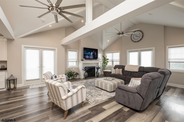 living room with dark wood-type flooring, high vaulted ceiling, and ceiling fan