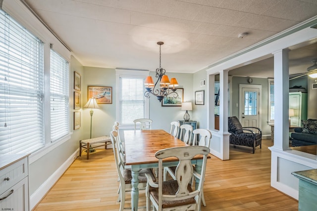 dining space featuring ceiling fan with notable chandelier and light hardwood / wood-style floors