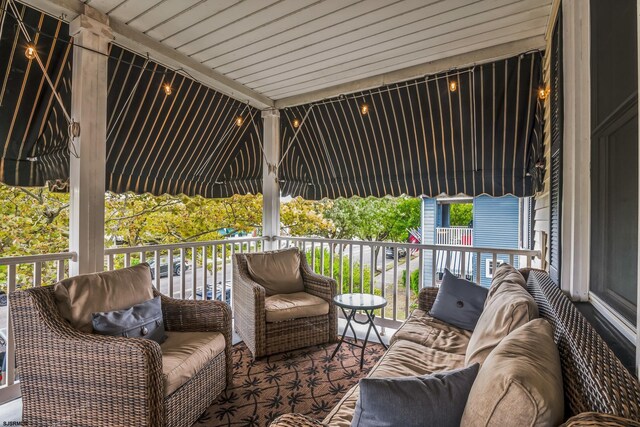 view of patio / terrace with a balcony