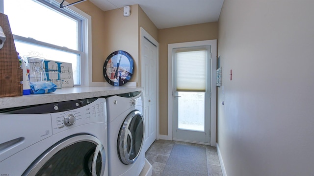 washroom featuring washing machine and dryer