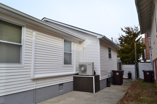 view of side of property featuring ac unit