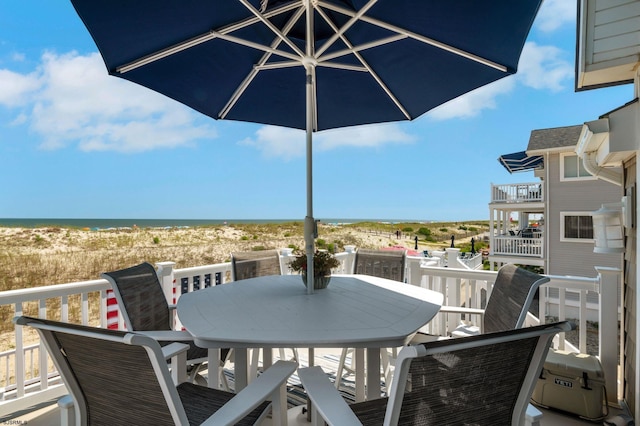 exterior space featuring a view of the beach and a water view