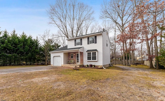 view of front facade featuring a garage and a front lawn