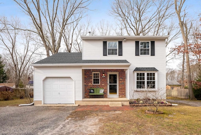 view of front facade with a front yard and a garage