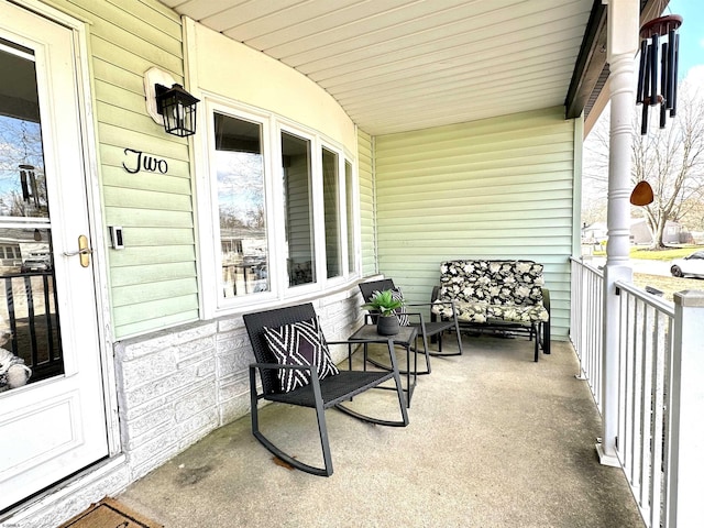 balcony featuring a porch