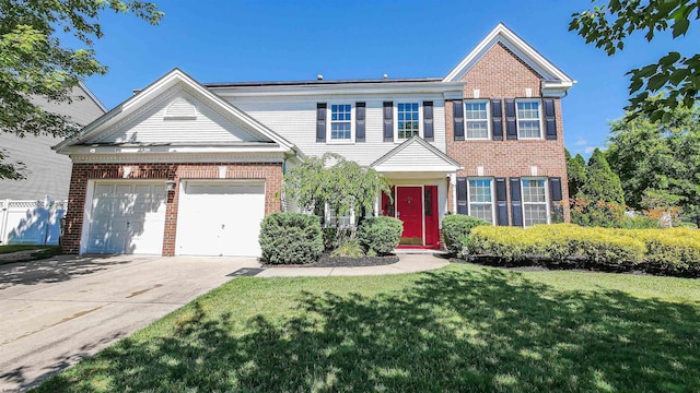 view of front of home with a garage and a front lawn