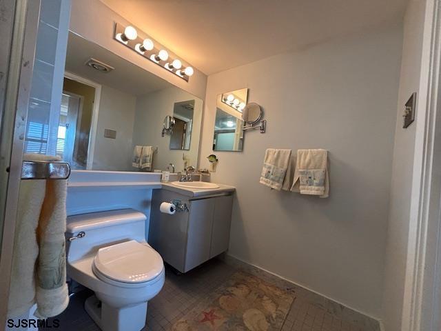 bathroom with toilet and vanity