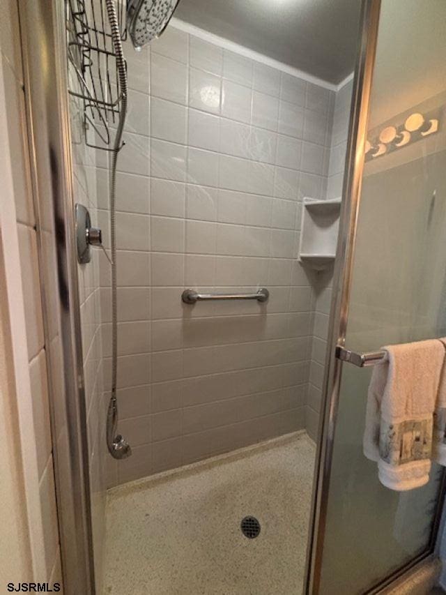 bathroom with a shower stall