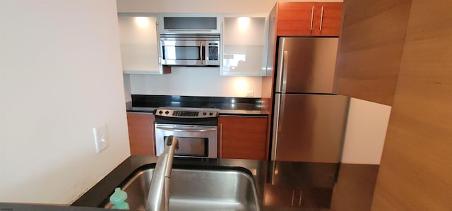 kitchen featuring appliances with stainless steel finishes and sink