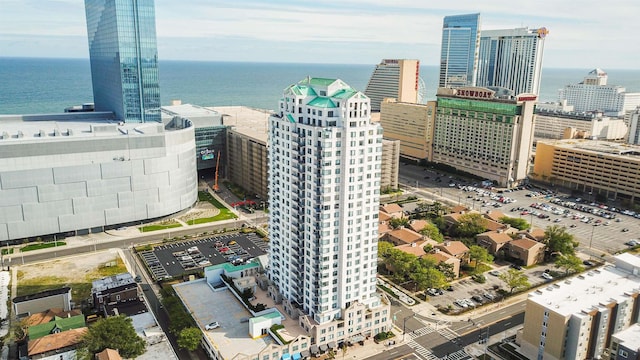 birds eye view of property with a water view