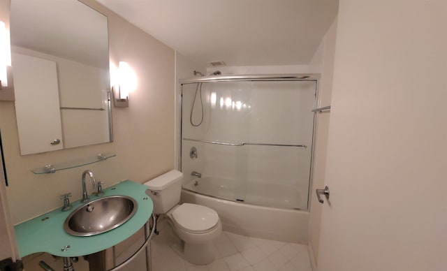 full bathroom with combined bath / shower with glass door, toilet, and sink