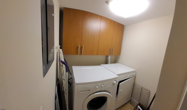 laundry area with cabinets and washing machine and dryer