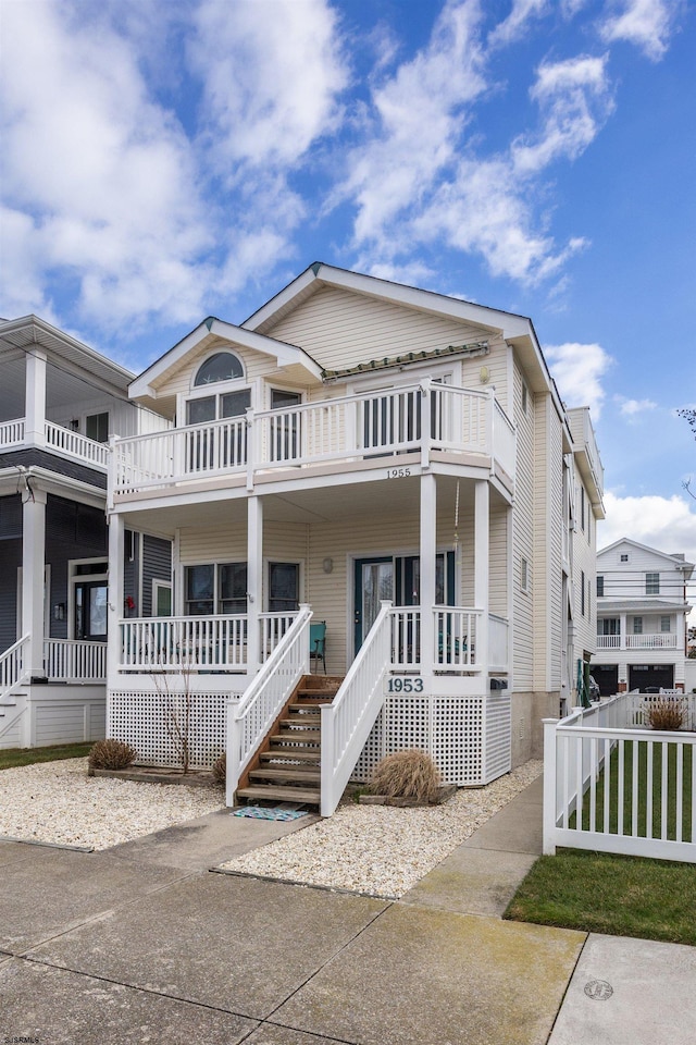 view of front facade featuring covered porch and a balcony