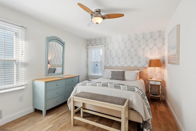 bedroom featuring ceiling fan and light hardwood / wood-style floors