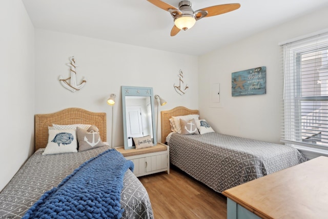 bedroom featuring ceiling fan and wood-type flooring