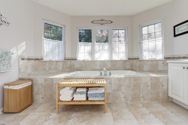 bathroom with tiled bath