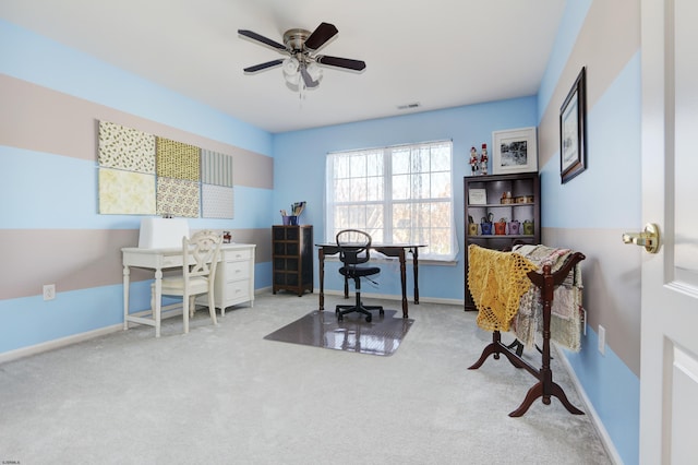 office area featuring light carpet and ceiling fan