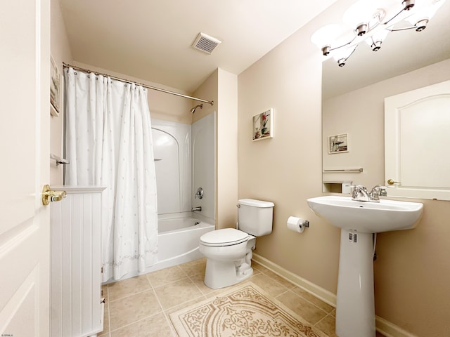 full bathroom with tile patterned floors, sink, shower / bath combo with shower curtain, and toilet