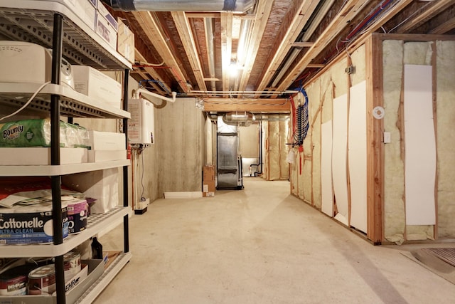 basement featuring heating unit and water heater