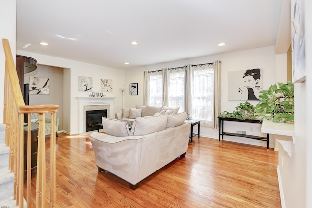 living room with light hardwood / wood-style flooring