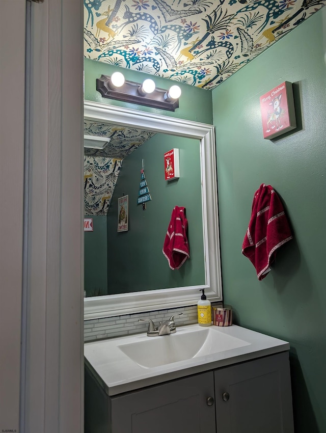 bathroom with tasteful backsplash and vanity