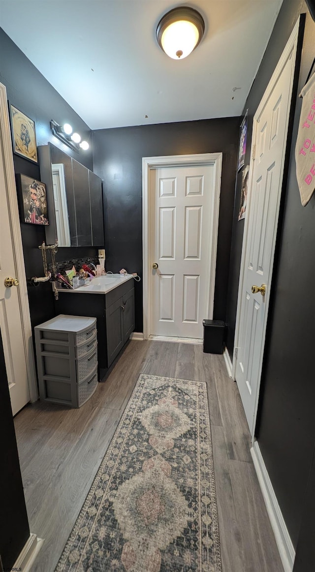 bathroom featuring hardwood / wood-style floors and vanity