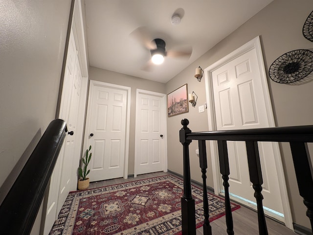 interior space featuring wood-type flooring and ceiling fan